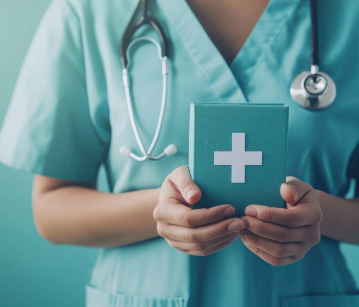 Doctor holding a turquoise medical box with a white cross